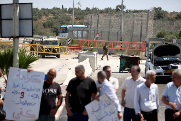 Palestinians protest Israeli military blockade at entrance of Azzun town in West Bank QALQILYA, WEST BANK, PALESTINE - JULY 12: Palestinians gather to protest against the ongoing closure of the entrance to Azzun town, located east of Qalqilya in the West Bank, Palestine on July 12, 2026. The Israeli military has kept the town s entrance blocked with military checkpoints and iron barricades since October 7, 2023, severely disrupting the daily lives of local residents. Issam Rimawi Anadolu Qalqilya West Bank. Editorial use only. Please get in touch for any other usage.  Copyright: x2026xAnadoluxIssamxRimawix