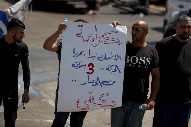Palestinians protest Israeli military blockade at entrance of Azzun town in West Bank QALQILYA, WEST BANK, PALESTINE - JULY 12: Palestinians gather to protest against the ongoing closure of the entrance to Azzun town, located east of Qalqilya in the West Bank, Palestine on July 12, 2026. The Israeli military has kept the town s entrance blocked with military checkpoints and iron barricades since October 7, 2023, severely disrupting the daily lives of local residents. Issam Rimawi Anadolu Qalqilya West Bank. Editorial use only. Please get in touch for any other usage.  Copyright: x2026xAnadoluxIssamxRimawix