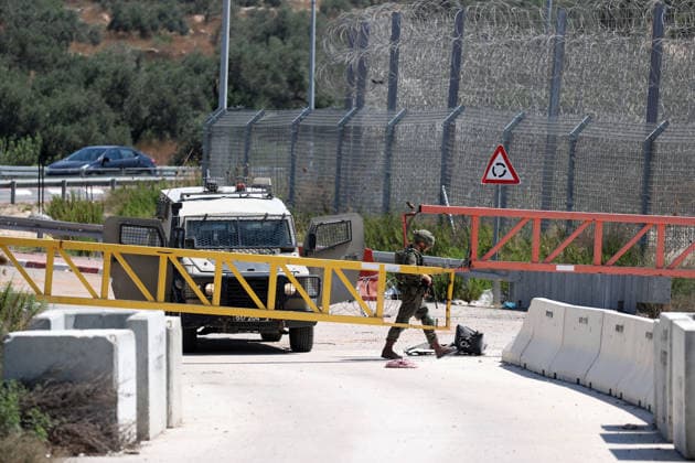 Palestinians protest Israeli military blockade at entrance of Azzun town in West Bank QALQILYA, WEST BANK, PALESTINE - JULY 12: Israeli forces take measures as Palestinians gather to protest against the ongoing closure of the entrance to Azzun town, located east of Qalqilya in the West Bank, Palestine on July 12, 2026. The Israeli military has kept the town s entrance blocked with military checkpoints and iron barricades since October 7, 2023, severely disrupting the daily lives of local residents. Issam Rimawi Anadolu Qalqilya West Bank. Editorial use only. Please get in touch for any other usage.  Copyright: x2026xAnadoluxIssamxRimawix