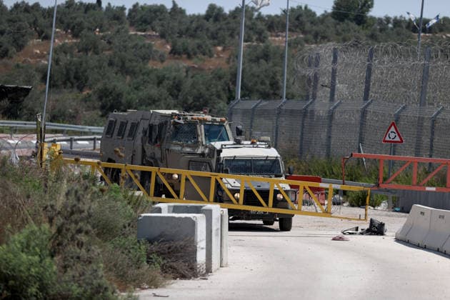 Palestinians protest Israeli military blockade at entrance of Azzun town in West Bank QALQILYA, WEST BANK, PALESTINE - JULY 12: Israeli forces take measures as Palestinians gather to protest against the ongoing closure of the entrance to Azzun town, located east of Qalqilya in the West Bank, Palestine on July 12, 2026. The Israeli military has kept the town s entrance blocked with military checkpoints and iron barricades since October 7, 2023, severely disrupting the daily lives of local residents. Issam Rimawi Anadolu Qalqilya West Bank. Editorial use only. Please get in touch for any other usage.  Copyright: x2026xAnadoluxIssamxRimawix