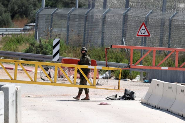 Palestinians protest Israeli military blockade at entrance of Azzun town in West Bank QALQILYA, WEST BANK, PALESTINE - JULY 12: Israeli forces take measures as Palestinians gather to protest against the ongoing closure of the entrance to Azzun town, located east of Qalqilya in the West Bank, Palestine on July 12, 2026. The Israeli military has kept the town s entrance blocked with military checkpoints and iron barricades since October 7, 2023, severely disrupting the daily lives of local residents. Issam Rimawi Anadolu Qalqilya West Bank. Editorial use only. Please get in touch for any other usage.  Copyright: x2026xAnadoluxIssamxRimawix