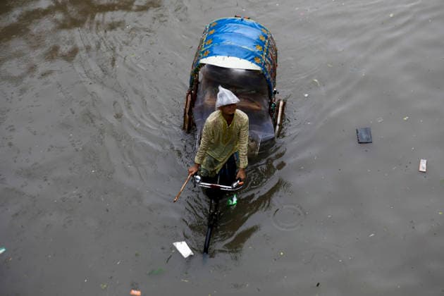 July 12, 2026, Dhaka, Dhaka, Bangladesh: Continuous rainfall submerged many roads in Dhaka under severe waterlogging on July 12, 2026. With rain continuing across the country, authorities warned that the situation could deteriorate further. The persistent downpours have also triggered flooding in several regions of Bangladesh. According to the latest reports, at least 51 people have died as a result of the floods. Dhaka Bangladesh - ZUMAj163 20260712_zip_j163_001 Copyright: xAbuxSufianxJewelx