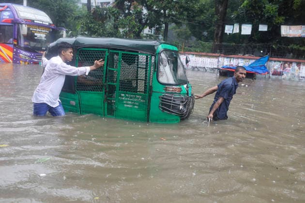 July 12, 2026, Dhaka, Dhaka, Bangladesh: Continuous rainfall submerged many roads in Dhaka under severe waterlogging on July 12, 2026. With rain continuing across the country, authorities warned that the situation could deteriorate further. The persistent downpours have also triggered flooding in several regions of Bangladesh. According to the latest reports, at least 51 people have died as a result of the floods. Dhaka Bangladesh  - ZUMAj163 20260712_zip_j163_016 Copyright: xAbuxSufianxJewelx