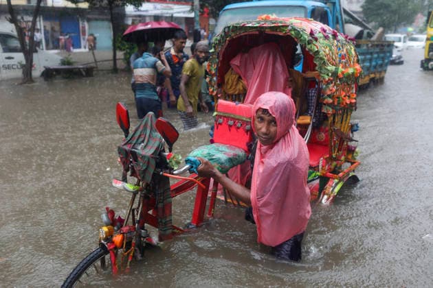 July 12, 2026, Dhaka, Dhaka, Bangladesh: Continuous rainfall submerged many roads in Dhaka under severe waterlogging on July 12, 2026. With rain continuing across the country, authorities warned that the situation could deteriorate further. The persistent downpours have also triggered flooding in several regions of Bangladesh. According to the latest reports, at least 51 people have died as a result of the floods. Dhaka Bangladesh  - ZUMAj163 20260712_zip_j163_060 Copyright: xAbuxSufianxJewelx