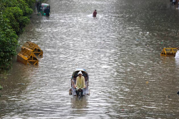 July 12, 2026, Dhaka, Dhaka, Bangladesh: Continuous rainfall submerged many roads in Dhaka under severe waterlogging on July 12, 2026. With rain continuing across the country, authorities warned that the situation could deteriorate further. The persistent downpours have also triggered flooding in several regions of Bangladesh. According to the latest reports, at least 51 people have died as a result of the floods. Dhaka Bangladesh  - ZUMAj163 20260712_zip_j163_072 Copyright: xAbuxSufianxJewelx