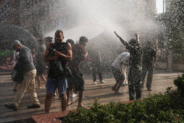 ARMENIA, YEREVAN - JULY 12, 2026: Citizens enjoy dousing each other during the traditional feast of Vardavar celebrated by the Armenian Apostolic Church to mark the Transfiguration of Christ. Alexander Patrin TASS  94974769