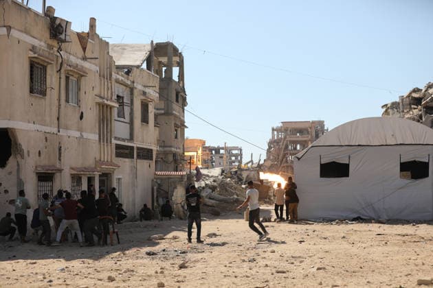 Palestinians seek shelter during Israeli airstrike in Gaza City Palestinians attempt to take cover from a massive explosion following an Israeli airstrike targeting a blacksmith workshop in the al-Sabra neighborhood of Gaza City, on July 12, 2026. Photo by Belal Osama apaimages Gaza Gaza Strip Palestinian Territory 120726_Gaza_BO_3_00(2) Copyright: xapaimagesxBelalxOsamax xapaimagesx