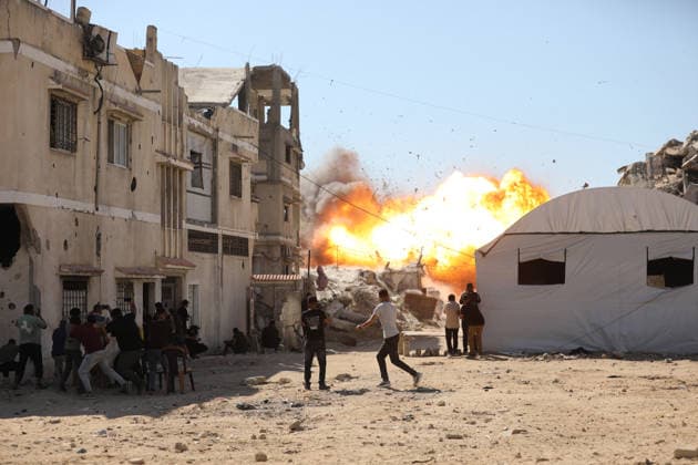 Palestinians seek shelter during Israeli airstrike in Gaza City Palestinians attempt to take cover from a massive explosion following an Israeli airstrike targeting a blacksmith workshop in the al-Sabra neighborhood of Gaza City, on July 12, 2026. Photo by Belal Osama apaimages Gaza Gaza Strip Palestinian Territory 120726_Gaza_BO_3_00(3) Copyright: xapaimagesxBelalxOsamax xapaimagesx