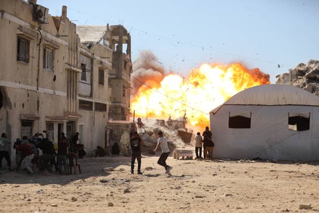 Palestinians seek shelter during Israeli airstrike in Gaza City Palestinians attempt to take cover from a massive explosion following an Israeli airstrike targeting a blacksmith workshop in the al-Sabra neighborhood of Gaza City, on July 12, 2026. Photo by Belal Osama apaimages Gaza Gaza Strip Palestinian Territory 120726_Gaza_BO_3_00(4) Copyright: xapaimagesxBelalxOsamax xapaimagesx