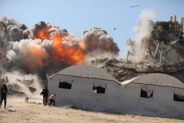 Palestinians seek shelter during Israeli airstrike in Gaza City Palestinians attempt to take cover from a massive explosion following an Israeli airstrike targeting a blacksmith workshop in the al-Sabra neighborhood of Gaza City, on July 12, 2026. Photo by Belal Osama apaimages Gaza Gaza Strip Palestinian Territory 120726_Gaza_BO_3_00(9) Copyright: xapaimagesxBelalxOsamax xapaimagesx