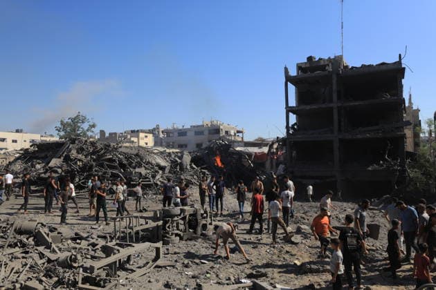Israeli attacks on Gaza continue in violation of the ceasefire GAZA CITY, GAZA, PALESTINE - JULY 12: Palestinians inspect the widespread destruction in the area caused by an unmanned aerial vehicle (UAV) strike where the Israeli army targeted several buildings with an UAV on Industrial Street in western Gaza City, Gaza, Palestine, on July 12, 2026. Khames Alrefi Anadolu Gaza City Gaza. Editorial use only. Please get in touch for any other usage.  Copyright: x2026xAnadoluxKhamesxAlrefix