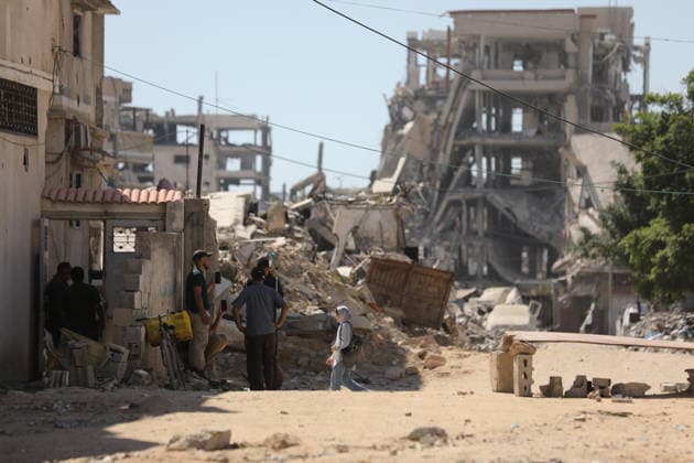 Palestinians inspect damage after Israeli airstrike in Gaza City Palestinians inspect the damage at the site of an Israeli airstrike that targeted a blacksmith workshop in the al-Sabra neighborhood of Gaza City, on July 12, 2026, as Civil Defense firefighters attempts to extinguish a fire that broke out in nearby vehicles and residential buildings following the strike. Photo by Belal Osama apaimages Gaza Gaza Strip Palestinian Territory 120726_Gaza_BO_4_00(1) Copyright: xapaimagesxBelalxOsamax xapaimagesx