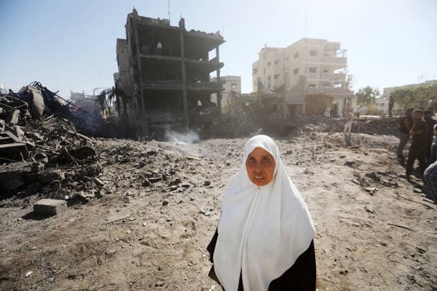 Palestinians inspect damage after Israeli airstrike in Gaza City Palestinians inspect the damage at the site of an Israeli airstrike that targeted a blacksmith workshop in the al-Sabra neighborhood of Gaza City, on July 12, 2026, as Civil Defense firefighters attempts to extinguish a fire that broke out in nearby vehicles and residential buildings following the strike. Photo by Belal Osama apaimages Gaza Gaza Strip Palestinian Territory 120726_Gaza_BO_4_00(21) Copyright: xapaimagesxBelalxOsamax xapaimagesx