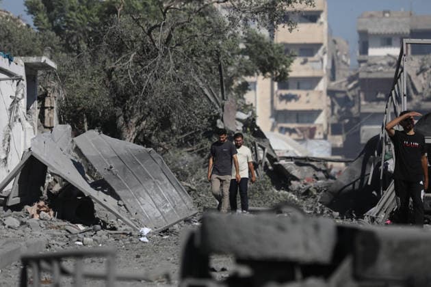 Palestinians inspect damage after Israeli airstrike in Gaza City Palestinians inspect the damage at the site of an Israeli airstrike that targeted a blacksmith workshop in the al-Sabra neighborhood of Gaza City, on July 12, 2026, as Civil Defense firefighters attempts to extinguish a fire that broke out in nearby vehicles and residential buildings following the strike. Photo by Belal Osama apaimages Gaza Gaza Strip Palestinian Territory 120726_Gaza_BO_4_00(23) Copyright: xapaimagesxBelalxOsamax xapaimagesx