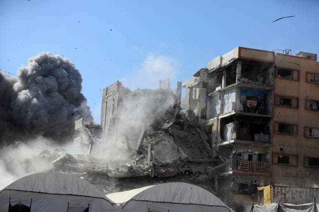 Palestinians inspect damage after Israeli airstrike in Gaza City Palestinians inspect the damage at the site of an Israeli airstrike that targeted a blacksmith workshop in the al-Sabra neighborhood of Gaza City, on July 12, 2026, as Civil Defense firefighters attempts to extinguish a fire that broke out in nearby vehicles and residential buildings following the strike. Photo by Belal Osama apaimages Gaza Gaza Strip Palestinian Territory 120726_Gaza_BO_4_00(3) Copyright: xapaimagesxBelalxOsamax xapaimagesx