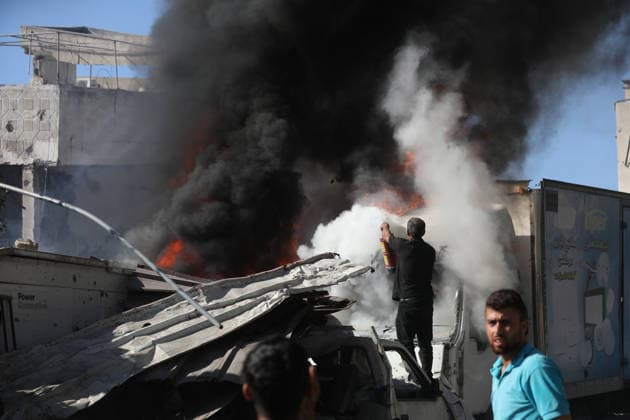 Palestinians inspect damage after Israeli airstrike in Gaza City Palestinians inspect the damage at the site of an Israeli airstrike that targeted a blacksmith workshop in the al-Sabra neighborhood of Gaza City, on July 12, 2026, as Civil Defense firefighters attempts to extinguish a fire that broke out in nearby vehicles and residential buildings following the strike. Photo by Belal Osama apaimages Gaza Gaza Strip Palestinian Territory 120726_Gaza_BO_4_00(28) Copyright: xapaimagesxBelalxOsamax xapaimagesx