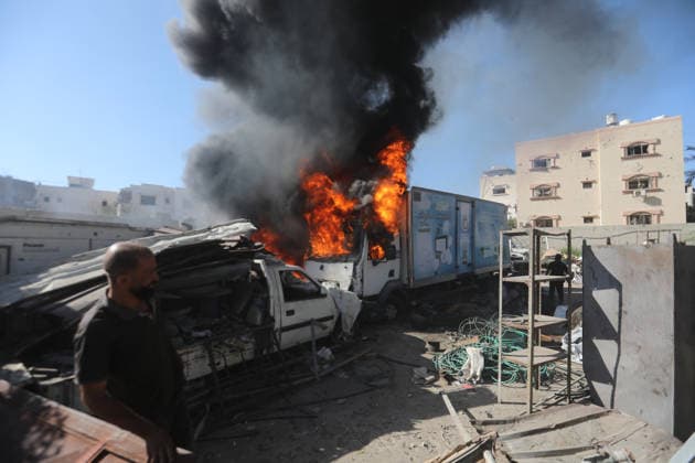 Palestinians inspect damage after Israeli airstrike in Gaza City Palestinians inspect the damage at the site of an Israeli airstrike that targeted a blacksmith workshop in the al-Sabra neighborhood of Gaza City, on July 12, 2026, as Civil Defense firefighters attempts to extinguish a fire that broke out in nearby vehicles and residential buildings following the strike. Photo by Belal Osama apaimages Gaza Gaza Strip Palestinian Territory 120726_Gaza_BO_4_00(31) Copyright: xapaimagesxBelalxOsamax xapaimagesx