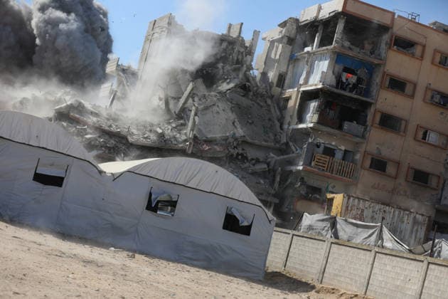 Palestinians inspect damage after Israeli airstrike in Gaza City Palestinians inspect the damage at the site of an Israeli airstrike that targeted a blacksmith workshop in the al-Sabra neighborhood of Gaza City, on July 12, 2026, as Civil Defense firefighters attempts to extinguish a fire that broke out in nearby vehicles and residential buildings following the strike. Photo by Belal Osama apaimages Gaza Gaza Strip Palestinian Territory 120726_Gaza_BO_4_00(2) Copyright: xapaimagesxBelalxOsamax xapaimagesx