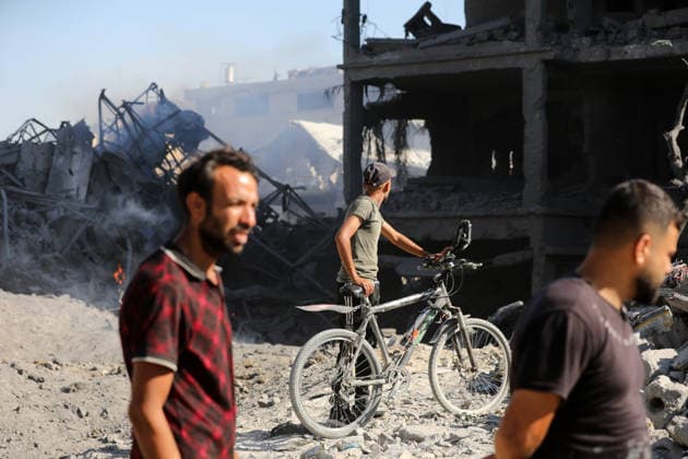 Palestinians inspect damage after Israeli airstrike in Gaza City Palestinians inspect the damage at the site of an Israeli airstrike that targeted a blacksmith workshop in the al-Sabra neighborhood of Gaza City, on July 12, 2026, as Civil Defense firefighters attempts to extinguish a fire that broke out in nearby vehicles and residential buildings following the strike. Photo by Belal Osama apaimages Gaza Gaza Strip Palestinian Territory 120726_Gaza_BO_4_00(26) Copyright: xapaimagesxBelalxOsamax xapaimagesx