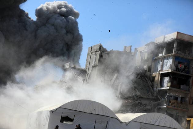Palestinians inspect damage after Israeli airstrike in Gaza City Palestinians inspect the damage at the site of an Israeli airstrike that targeted a blacksmith workshop in the al-Sabra neighborhood of Gaza City, on July 12, 2026, as Civil Defense firefighters attempts to extinguish a fire that broke out in nearby vehicles and residential buildings following the strike. Photo by Belal Osama apaimages Gaza Gaza Strip Palestinian Territory 120726_Gaza_BO_4_00(4) Copyright: xapaimagesxBelalxOsamax xapaimagesx