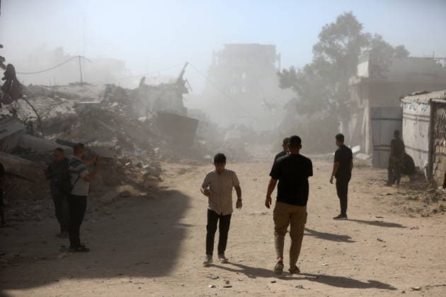 Palestinians inspect damage after Israeli airstrike in Gaza City Palestinians inspect the damage at the site of an Israeli airstrike that targeted a blacksmith workshop in the al-Sabra neighborhood of Gaza City, on July 12, 2026, as Civil Defense firefighters attempts to extinguish a fire that broke out in nearby vehicles and residential buildings following the strike. Photo by Belal Osama apaimages Gaza Gaza Strip Palestinian Territory 120726_Gaza_BO_4_00(5) Copyright: xapaimagesxBelalxOsamax xapaimagesx