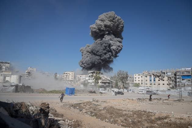 July 12, 2026, Gaza, Palestine, State of: GAZA Gaza, PALESTINE Ã¢â‚¬ JULY 12, 2026: Israeli warplanes strike a maintenance workshop on Al-Sinaa Street in western Gaza City on Sunday evening with three missiles following an evacuation warning. Several Palestinians are injured in the attack. Mohammed M. Skaik JNA PRESS Gaza Palestine, State of  - ZUMAq101 20260712_zna_q101_105 Copyright: xMohammedxMxSkaikx
