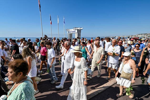 Commemorative White March in honor of the victims of the July 14, 2016, attack on the Promenade des Anglais in Nice, on July 12, 2026. The city of Nice and various victims’ associations organized a march, which began near Lenval Hospital, where the truck plowed into the crowd in 2016, killing 86 people and injuring more than 400. The procession stopped in front of the memorial sculpture *L’Ange de la Baie*, created by Jean Marie Fondacaro, for a wreath-laying ceremony before proceeding to the Albert I Garden, where everyone was able to place a white rose in front of the bandstand. The mayor of Nice, E. Ciotti, along with his partner O. Péraldi, the Prefect of the Alpes-Maritimes, L. Houttiaux, and members of his city council, such as Dep  Copyright: xBrunoxBebertx xBestimagexBrunoxBebertx xBestimagex