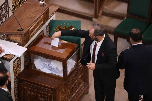 Sharaa calls for new chapter in Syria s history as new parliament convenes DAMASCUS, SYRIA - JULY 12: Syrian legislators cast their votes during the first session of the newly formed People s Assembly at the parliament building following the fall of the Assad regime, in Damascus, Syria, on July 12, 2026. Izz Aldien Alqasem Anadolu Damascus Syria. Editorial use only. Please get in touch for any other usage.  Copyright: x2026xAnadoluxIzzxAldienxAlqasemx
