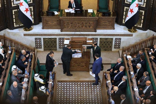 Syrian Parliament Members Vote for New Speaker in the Presence of President Ahmed al-Sharaa Damascus, Syria - July 12, 2026: Members of Syria s newly formed People s Assembly cast their votes to elect the speaker of the parliament during the historic inaugural session held in the presence of Syrian President Ahmed al-Sharaa for the first time since the fall of the Bashar al-Assad regime. Damascus Syria Copyright: xMohammadxBashirxAldaherx