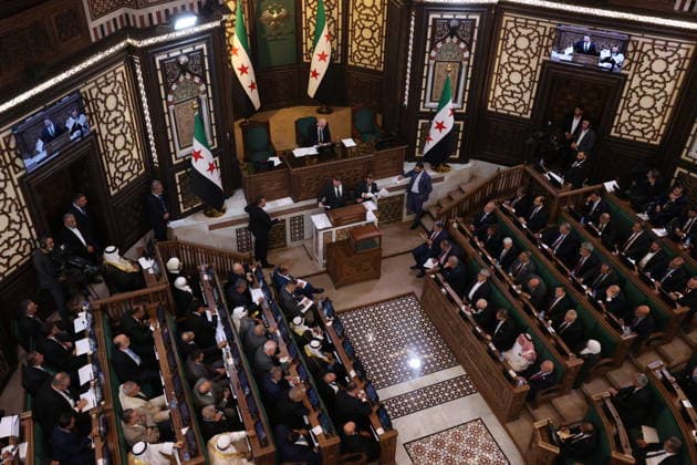 Sharaa calls for new chapter in Syria s history as new parliament convenes DAMASCUS, SYRIA - JULY 12: Syrian legislators cast their votes during the first session of the newly formed People s Assembly at the parliament building following the fall of the Assad regime, in Damascus, Syria, on July 12, 2026. Izz Aldien Alqasem Anadolu Damascus Syria. Editorial use only. Please get in touch for any other usage.  Copyright: x2026xAnadoluxIzzxAldienxAlqasemx