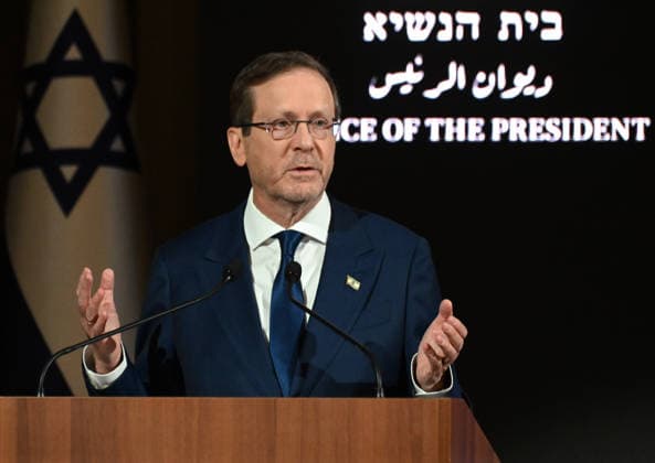 Israeli President Isaac Herzog speaks at a ceremony marking 50 years since Operation Entebbe, Operation Yonathan, at the president s residence in Jerusalem on Sunday, July 12, 2026. Prime Minister Benjamin Netanyahu s oldest brother Yonathan was killed in the legendary 1976 Israeli counter-terrorist hostage rescue mission in Uganda.  JER2026071214 DEBBIExHILL