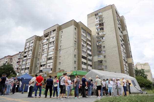 RECORD DATE NOT STATED People affected by a Russian ballistic missile strike wait in line at a mobile tent of the State Emergency Service of Ukraine to receive assistance in the Darnytskyi district of Kyiv, Ukraine, on July 11, 2026. During the night of July 11, Russian forces launched their third ballistic missile attack on Kyiv in a week. Twelve people, including two children aged 10 and 11, were injured (Photo by Yuliia Ovsiannikova Ukrinform) Cleanup underway after Russian attack in Darnytskyi district of Kyiv  Copyright: xYuliiaxOvsiannikovax