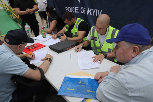 RECORD DATE NOT STATED Officers of the National Police of Ukraine receive statements from local residents affected by a Russian ballistic missile strike in the Darnytskyi district of Kyiv, Ukraine, on July 11, 2026. During the night of July 11, Russian forces launched their third ballistic missile attack on Kyiv in a week. Twelve people, including two children aged 10 and 11, were injured (Photo by Yuliia Ovsiannikova Ukrinform) Cleanup underway after Russian attack in Darnytskyi district of Kyiv  Copyright: xYuliiaxOvsiannikovax
