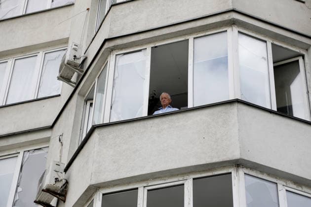 RECORD DATE NOT STATED A man stands at the window of a residential building damaged by a Russian ballistic missile strike in the Darnytskyi district of Kyiv, Ukraine, on July 11, 2026. During the night of July 11, Russian forces launched their third ballistic missile attack on Kyiv in a week. Twelve people, including two children aged 10 and 11, were injured (Photo by Yuliia Ovsiannikova Ukrinform) Cleanup underway after Russian attack in Darnytskyi district of Kyiv  Copyright: xYuliiaxOvsiannikovax