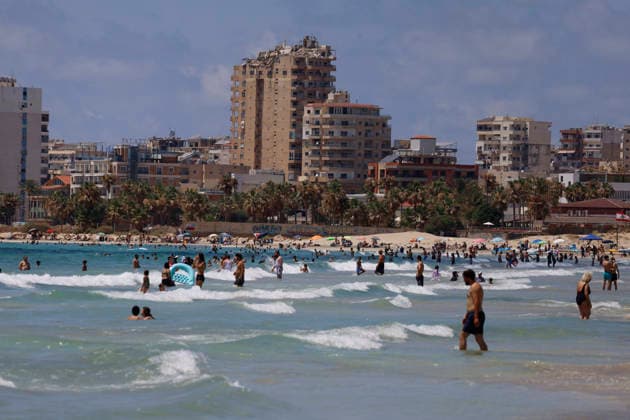 July 12, 2026, Tyre, South Lebanon, lebanon: Description:.People enjoy the seaside at Tyre Beach in the southern Lebanese city of Tyre (Sour), Lebanon, on July 12, 2026. Families, swimmers, and visitors gathered along one of Lebanon s most popular public beaches as the city welcomed the summer season. Despite the impact of recent conflict, the beach has once again become a destination for locals and tourists seeking the Mediterranean coast, with beachfront businesses and seasonal facilities reopening for the summer. Tyre lebanon  - ZUMAb339 20260712_znp_b339_006 Copyright: xAbdulxKaderxAlxBayx