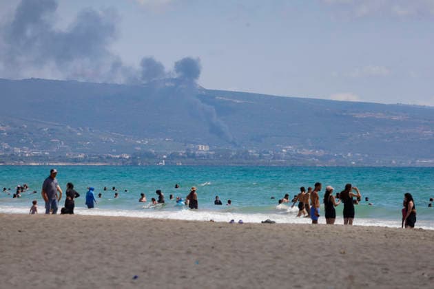 July 12, 2026, Tyre, South Lebanon, lebanon: Description:.People enjoy the seaside at Tyre Beach in the southern Lebanese city of Tyre (Sour), Lebanon, on July 12, 2026. Families, swimmers, and visitors gathered along one of Lebanon s most popular public beaches as the city welcomed the summer season. Despite the impact of recent conflict, the beach has once again become a destination for locals and tourists seeking the Mediterranean coast, with beachfront businesses and seasonal facilities reopening for the summer. Tyre lebanon - ZUMAb339 20260712_znp_b339_009 Copyright: xAbdulxKaderxAlxBayx