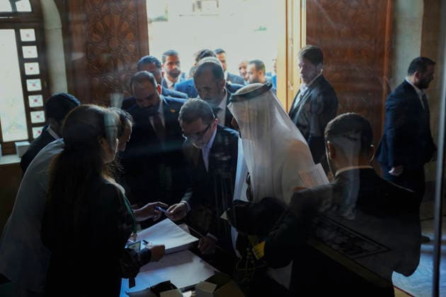 Damascus Syria Parliament First Session Members of Syria s People s Assembly check documents before the first session of the country s new parliament in Damascus, Syria, on July 12, 2026. The 210-member assembly is Syria s first parliament since the fall of the Assad government in December 2024 and is tasked with legislating during the transitional period. Damascus Damascus Syria Copyright: xOmarxAlbamx