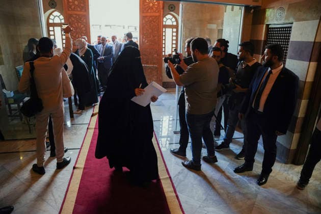 Damascus Syria Parliament First Session A woman carrying documents walks through the People s Assembly building as members arrive for the first session of Syria s new parliament in Damascus on July 12, 2026. The 210-member assembly is Syria s first parliament since the fall of the Assad government in December 2024 and is tasked with legislating during the transitional period. Damascus Damascus Syria Copyright: xOmarxAlbamx