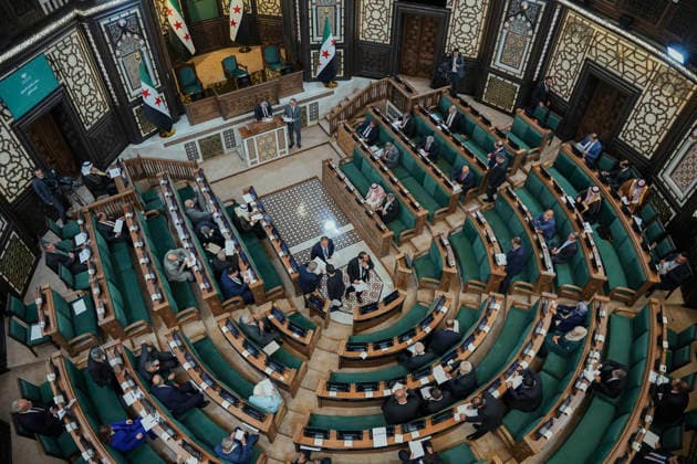 Damascus Syria Parliament First Session Members of Syria s People s Assembly take their seats in the parliamentary chamber during the first session of the country s new parliament in Damascus, Syria, on July 12, 2026. The 210-member assembly is Syria s first parliament since the fall of the Assad government in December 2024 and is tasked with legislating during the transitional period. Damascus Damascus Syria Copyright: xOmarxAlbamx