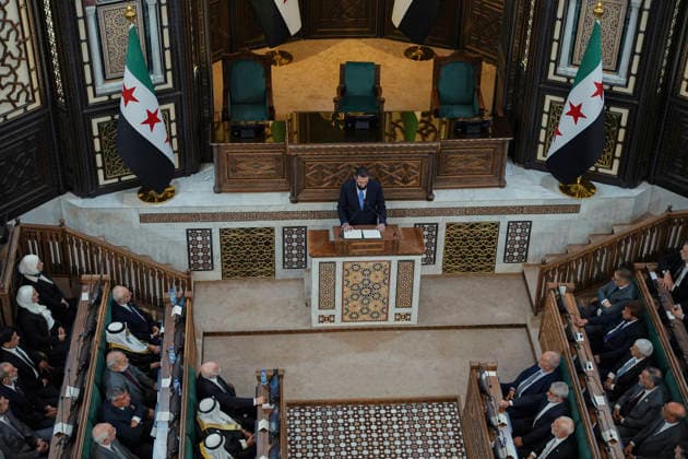 Damascus Syria Parliament First Session Syria s President Ahmed al-Sharaa (top, C) addresses members of Syria s People s Assembly during the first session of the country s new parliament in Damascus, Syria, on July 12, 2026. The assembly s 30-month transitional term includes reviewing legislation, overseeing government work and approving the state budget and international treaties. Damascus Damascus Syria Copyright: xOmarxAlbamx