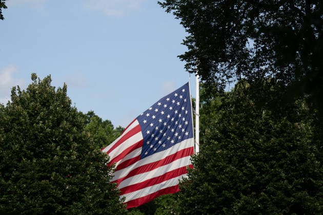July 12, 2026, Washington, Dc, United States: Flags at the White House and Executive Office Buildings are lowered to half staff in memory of Senator Lindsey Graham who died on July 12, 2026. Washington United States - ZUMAl312 20260712_znp_l312_019 Copyright: xAndrewxLeydenx