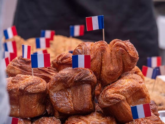 July 12, 2026, New York, New York, USA: French baked goods for sale at New York City s largest public Bastille Day celebration hosted by.L Alliance New York took place on Madison Ave with a massive block.party with gourmet and lifestyle vendors, classic Citroens, a dog parade and a .monumental street Goose Game. New York USA - ZUMAh156 20260712_znp_h156_015 Copyright: xMiloxHessx