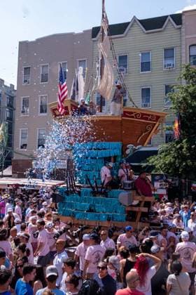 July 12, 2026, New York, New York, USA: A 4-ton replica of a boat is paraded down the street as a young boy tosses confetti from it...The Ã¢â‚¬oeDancing of the GiglioÃ¢â‚¬Â is an annual event, held in Williamsburg, Brooklyn in front of Our Lady of Mount Carmel. The Italian community takes part in a 139 year old tradiontion celebration heritage, faith and culture. New York USA - ZUMAp288 20260712_znp_p288_011 Copyright: xSyndixPilarx