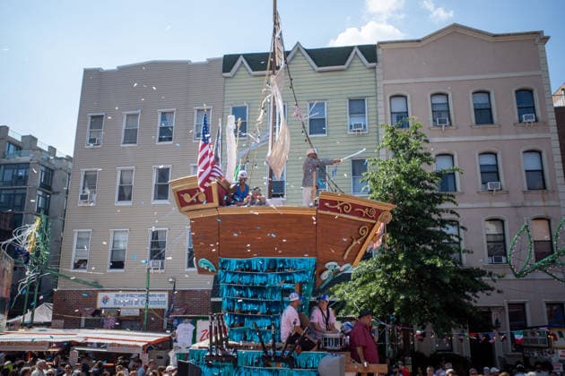 July 12, 2026, New York, New York, USA: A 4-ton replica of a boat is paraded down the street as a young boy tosses confetti from it...The Ã¢â‚¬oeDancing of the GiglioÃ¢â‚¬Â is an annual event, held in Williamsburg, Brooklyn in front of Our Lady of Mount Carmel. The Italian community takes part in a 139 year old tradiontion celebration heritage, faith and culture. New York USA - ZUMAp288 20260712_znp_p288_013 Copyright: xSyndixPilarx