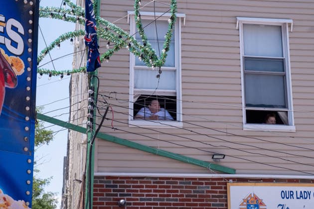 July 12, 2026, New York, New York, USA: Women watch the Giglio lifts from their windows...The Ã¢â‚¬oeDancing of the GiglioÃ¢â‚¬Â is an annual event, held in Williamsburg, Brooklyn in front of Our Lady of Mount Carmel. The Italian community takes part in a 139 year old tradiontion celebration heritage, faith and culture. New York USA - ZUMAp288 20260712_znp_p288_015 Copyright: xSyndixPilarx