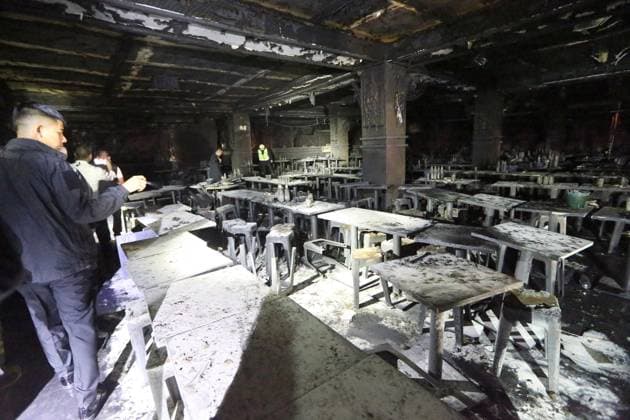 (260713) -- BANGKOK, July 13, 2026 -- Rescuers work at a pub where a fire broke out in Bangkok, Thailand, July 13, 2026. A fire at a pub near Lat Phrao Road in Bangkok s Chatuchak district killed 27 people and injured more than 10 others late Sunday, Thai media reported. The fire broke out at around 11:57 p.m. local time and was later extinguished. The injured were taken to hospitals for treatment. ) (SpotNews) THAILAND-BANGKOK-PUB-FIRE RachenxSageamsak 