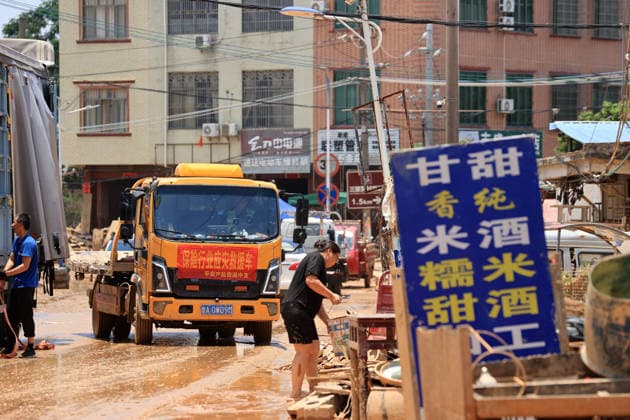 GUIGANG, CHINA - JULY 12: A villager clean furniture soaked by floodwaters on July 12, 2026 in Guigang, Guangxi Zhuang Autonomous Region of China. Floodwaters have receded and residents lives have returned to normal.  Copyright: xVCGx 111653899642