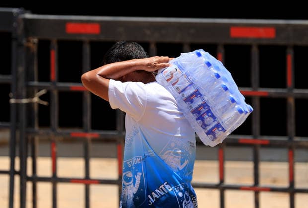 GUIGANG, CHINA - JULY 12: A flood-affected resident receives clean drinking water on July 12, 2026 in Guigang, Guangxi Zhuang Autonomous Region of China. Floodwaters have receded and residents lives have returned to normal.  Copyright: xVCGx 111653899644