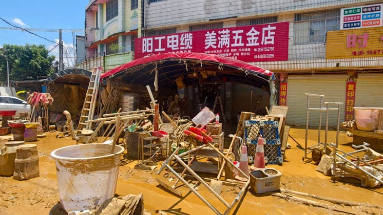 GUIGANG, CHINA - JULY 12: A view of shops and houses soaked by floodwaters along the street on July 12, 2026 in Guigang, Guangxi Zhuang Autonomous Region of China. Floodwaters have receded, and mud remains on the road surfaces.  Copyright: xVCGx 111653899645