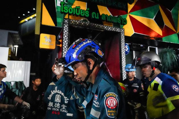 Bangkok Pub Fire Kills At Least 27 People Members of emergency personnel work at the site of a deadly fire at a pub in Bangkok, Thailand, on July 13, 2026. A large fire engulfs a pub in Bangkok early on Monday morning local time, resulting in the deaths of at least 27 people before firefighters bring the blaze under control, according to officials. Bangkok Bangkok Thailand  Copyright: xAnusakxLaowilasx originalFilename: laowilas-notitle260713_npGGS.jpg